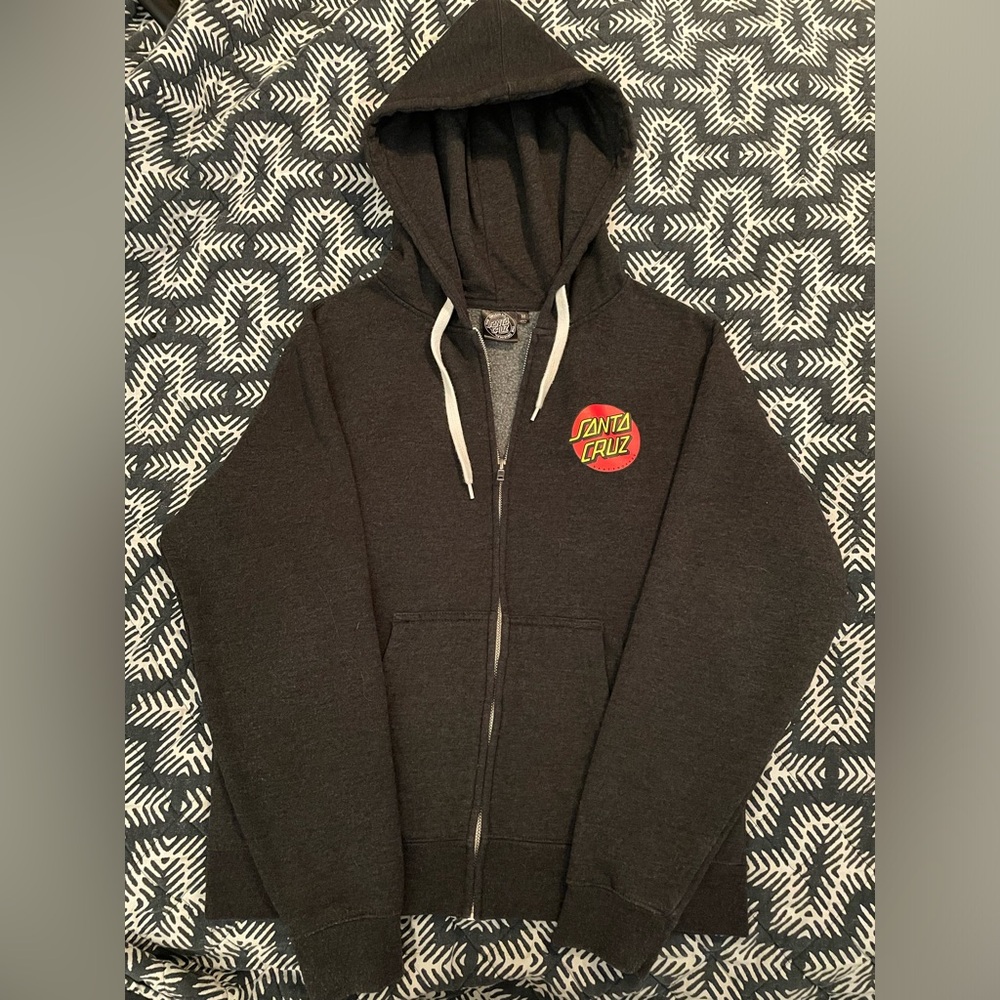 This is a Medium dark grey zip up hoodie